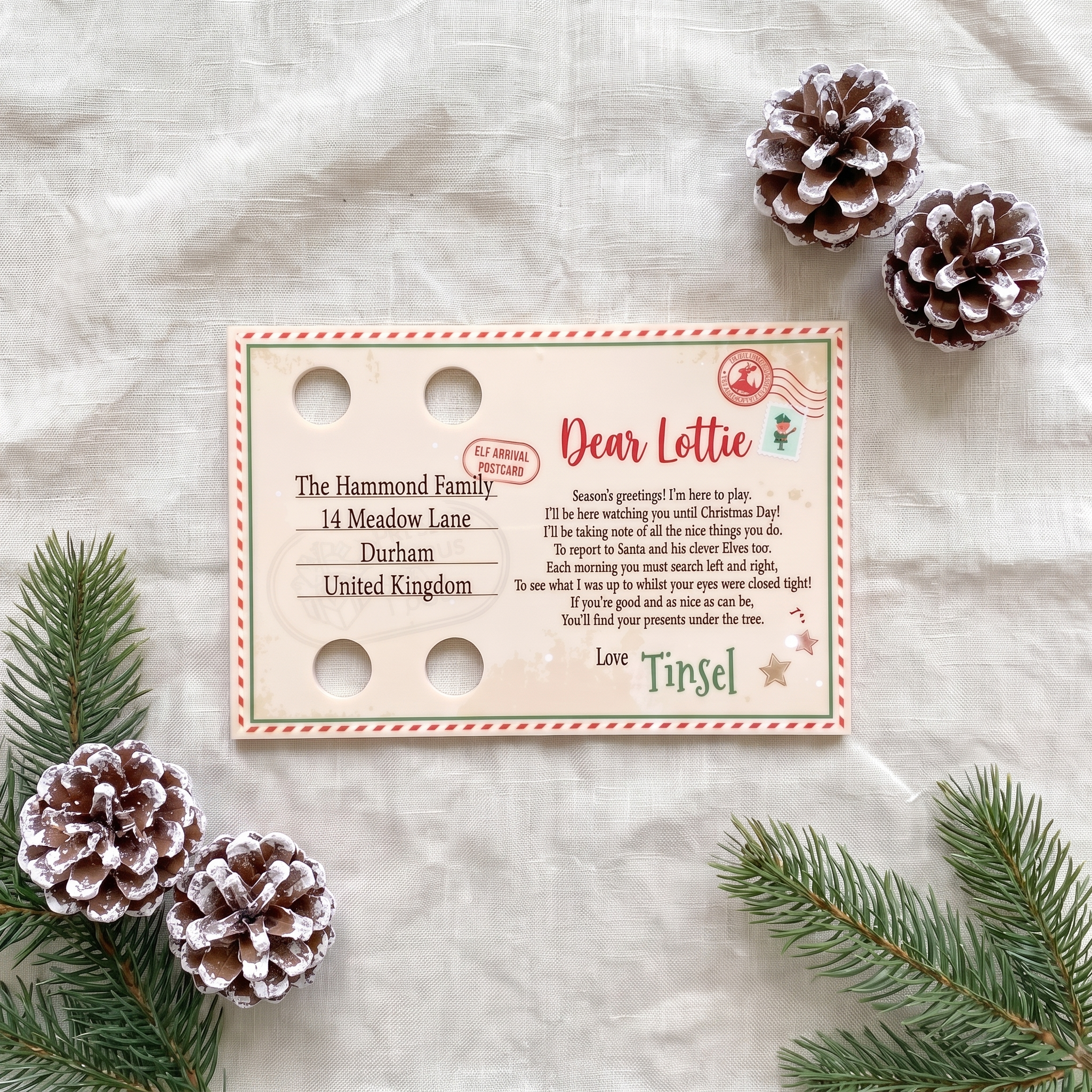 Personalised acrylic Elf Arrival Postcard laid flat showing the printed verse and name spaces