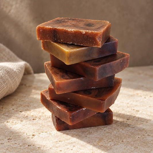 Stack of Emerald Truffle soap slices in amber and brown swirls