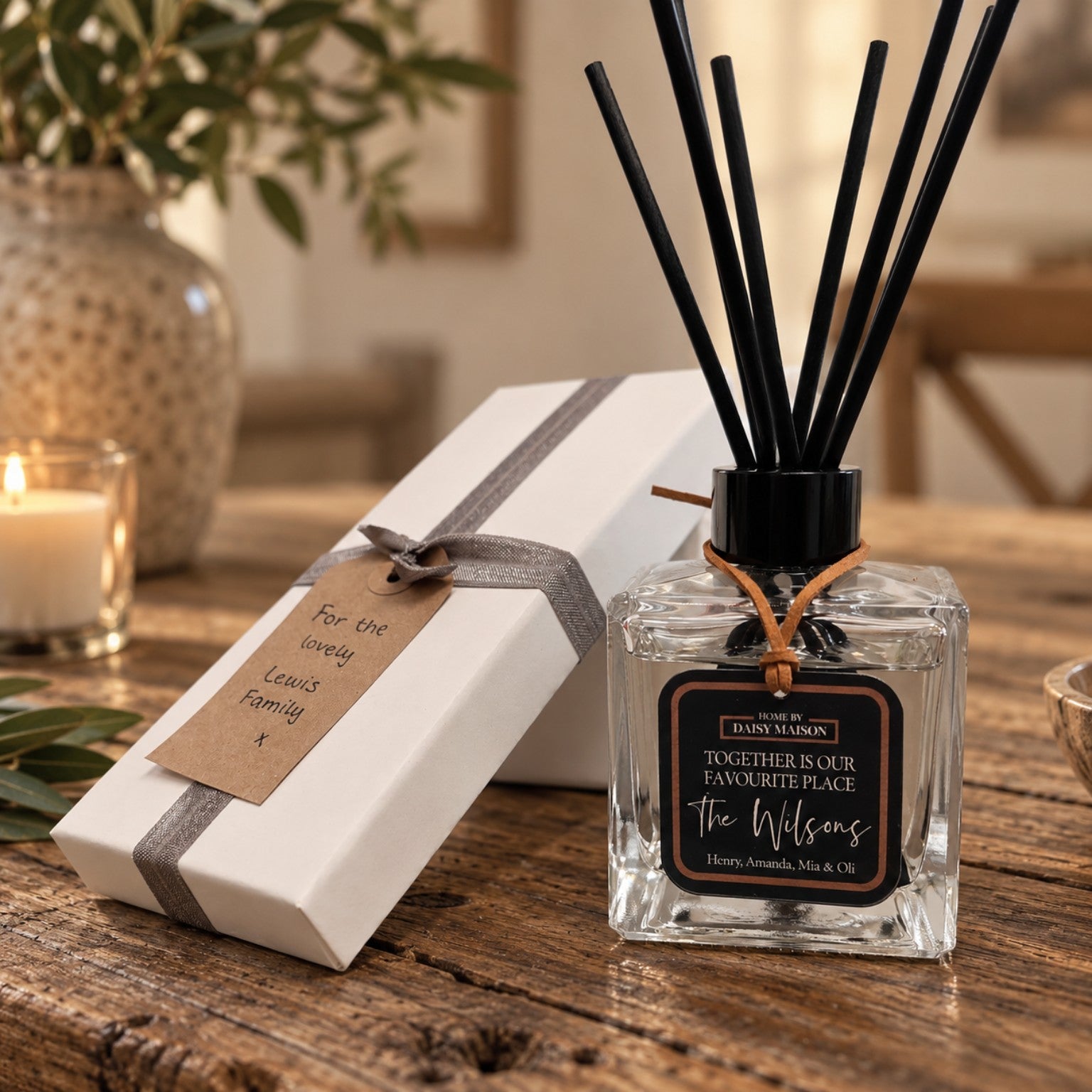 Personalised family reed diffuser with gift box on a warm rustic table