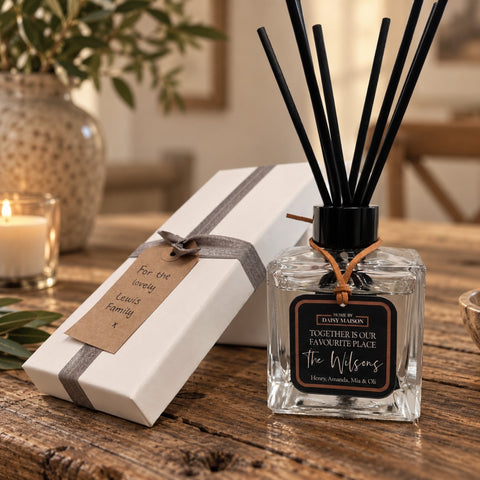 Personalised family reed diffuser with gift box on a warm rustic table