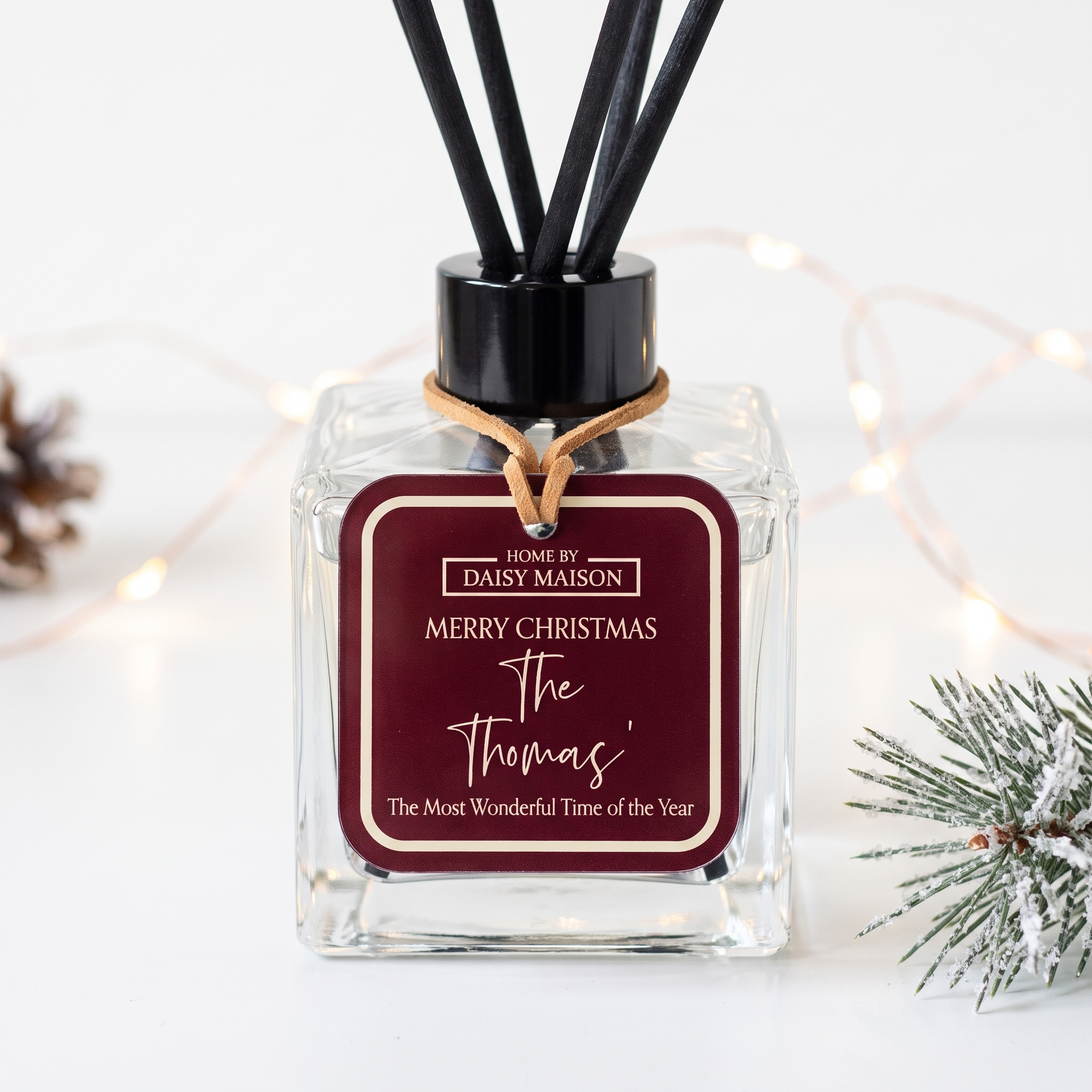 Personalised Christmas reed diffuser close-up, Merry Christmas The Thomas' tag