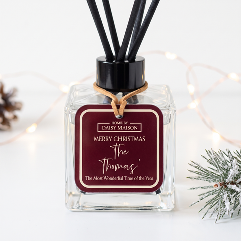 Personalised Christmas reed diffuser close-up, Merry Christmas The Thomas' tag