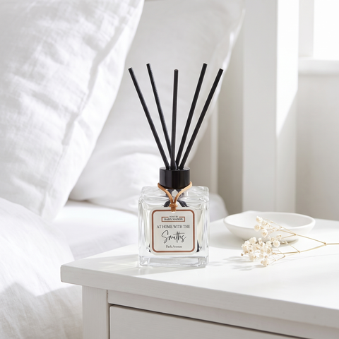 Personalised family reed diffuser on a bright white bedside table
