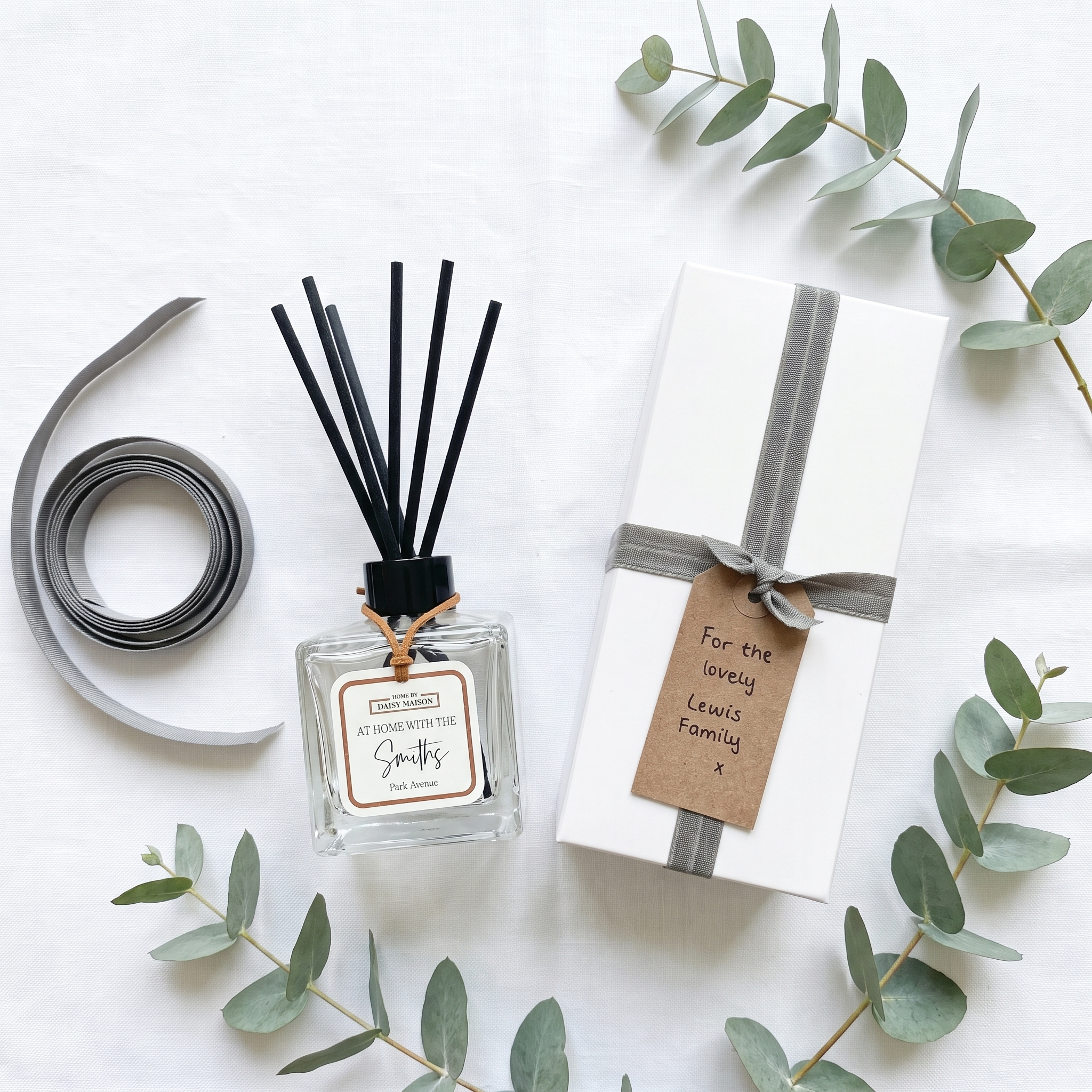 Personalised family reed diffuser gift set flat-lay with white gift box and eucalyptus