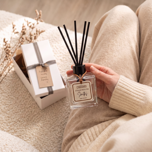 Personalised family reed diffuser held in a cosy lounge with gift box, At Home With The Smiths, Park Avenue