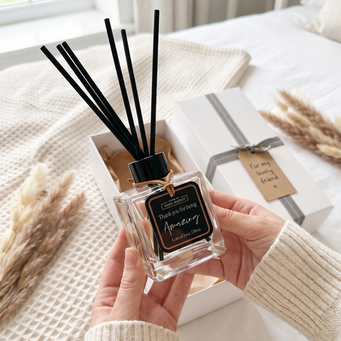 Personalised friendship reed diffuser with black tag being unboxed as a gift, Thank You For Being Amazing, Lots of love Olivia