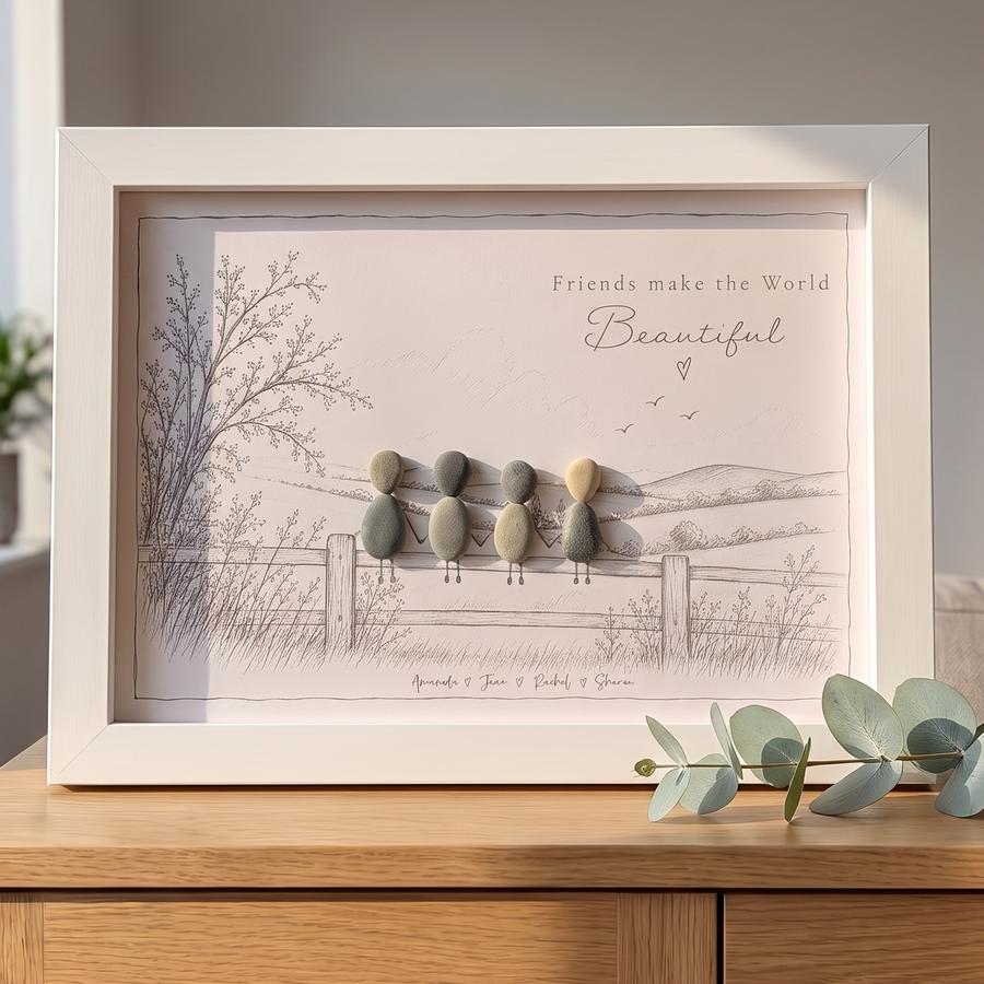 ‘Friends make the World Beautiful’ personalised pebble picture in a white frame on an oak sideboard