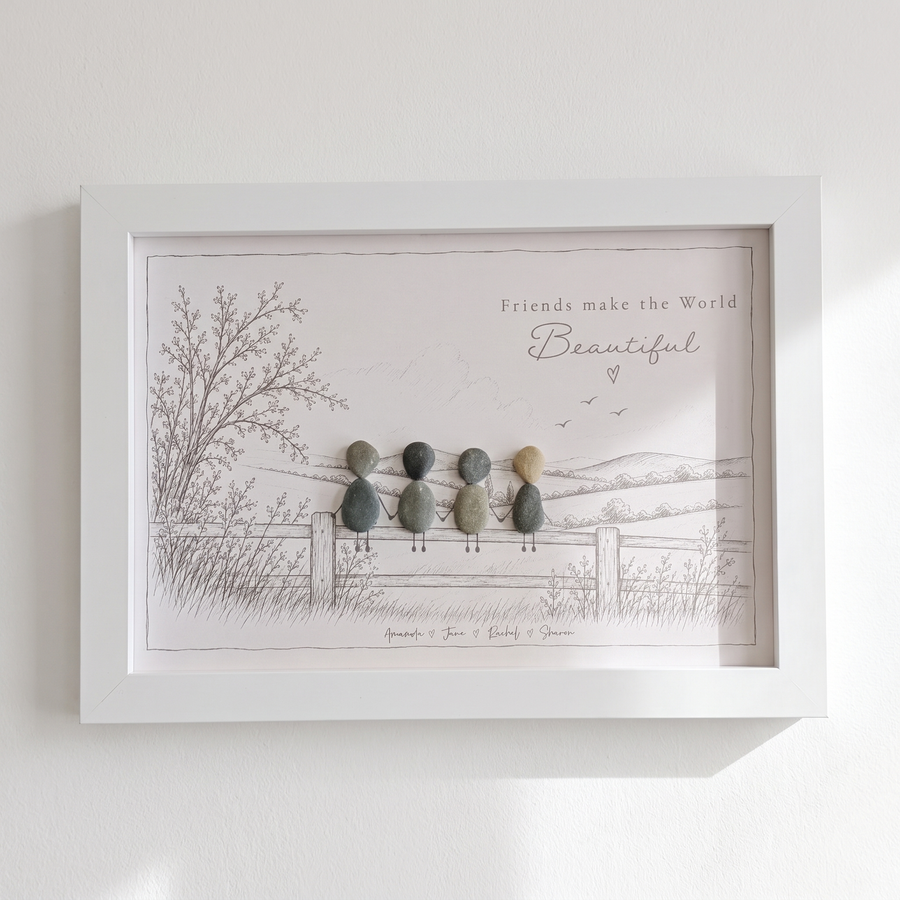 ‘Friends make the World Beautiful’ pebble picture hanging on a bright white wall
