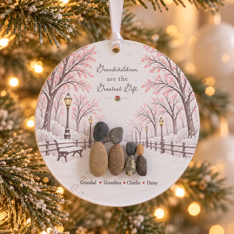 Grandchildren are the Greatest Gift pebble decoration hanging on a frosted Christmas tree