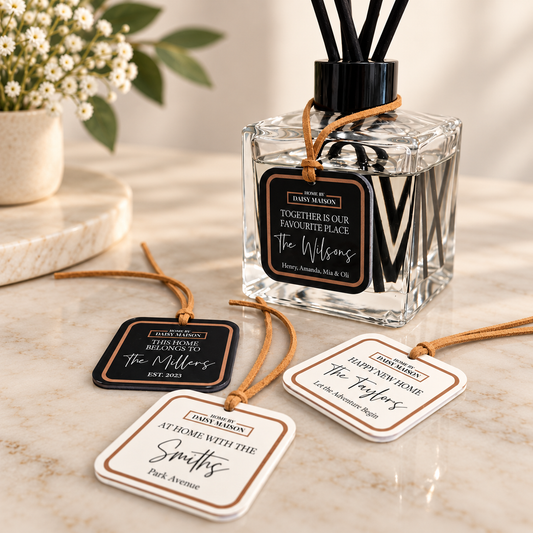 Personalised family reed diffuser with family name tags on an elegant neutral marble background