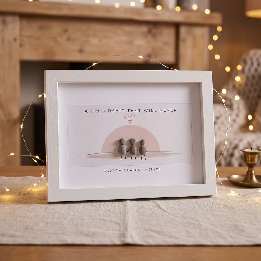 Together friendship pebble picture on a linen runner with fairy lights: A Friendship That Will Never fade, three pebble people